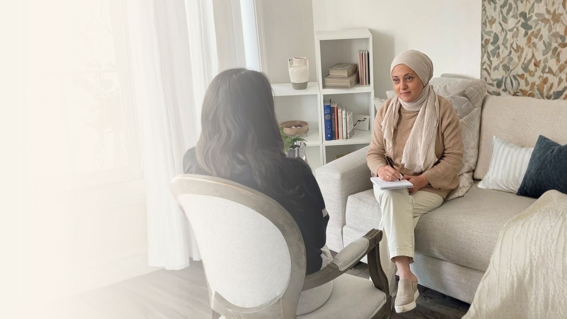 A Maristan therapist in a warm conversation with a client during a session